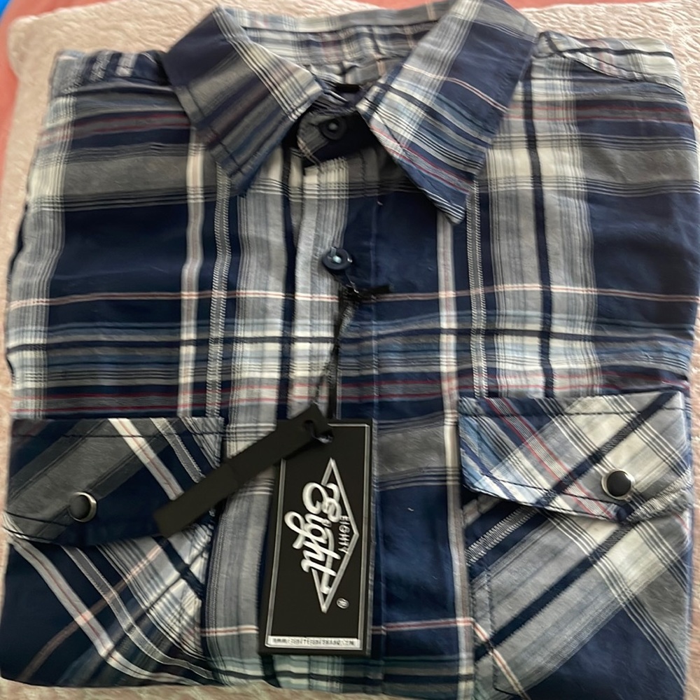 Blue plaid button down shirt. Size Medium .